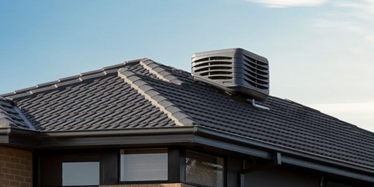 evaporative cooler on the roof of a house